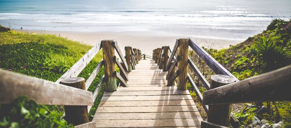 Una playa - Sputnik Mundo