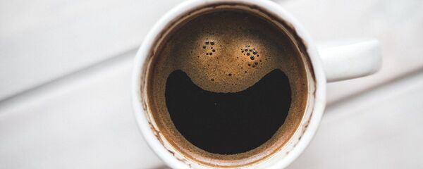 Una taza de café - Sputnik Mundo