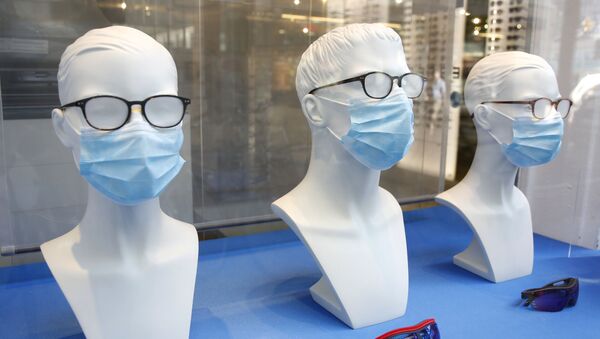Maniquíes con mascarillas (imagen referencial) - Sputnik Mundo