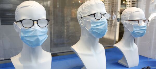 Maniquíes con mascarillas (imagen referencial) - Sputnik Mundo