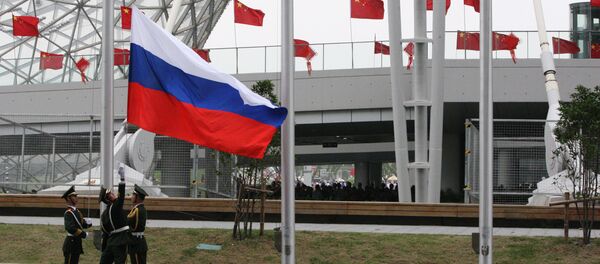 Bandera de Rusia en China - Sputnik Mundo