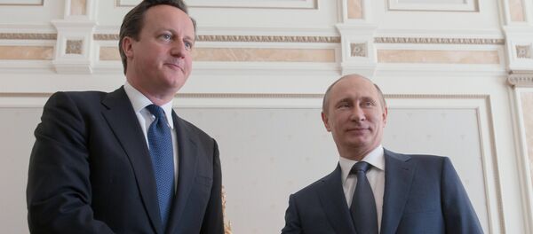 Primer ministro del Reino Unido, David Cameron, y presidente de Rusia, Vladímir Putin - Sputnik Mundo