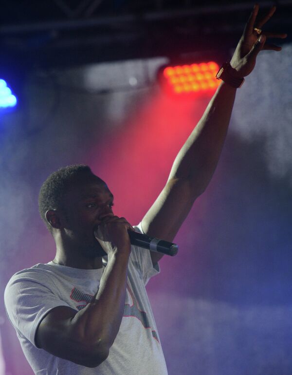 El pentacampeón mundial Usain Bolt en una fiesta jamaiquina en Moscú - Sputnik Mundo