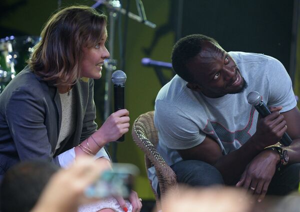 El pentacampeón mundial Usain Bolt en una fiesta jamaiquina en Moscú - Sputnik Mundo