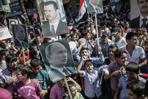 Manifestación en apoyo a Asad y Putin en Siria - Sputnik Mundo