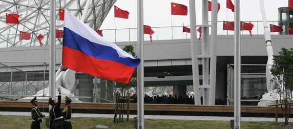 Bandera rusa en China - Sputnik Mundo