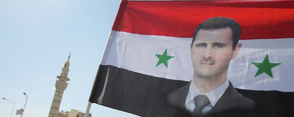 Митинг в поддержку Башара Асада в Дамаске - Sputnik Mundo