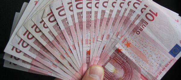 Евро в руке Евро в руке - Sputnik Mundo