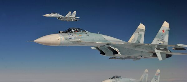 Russian Federation Air Force Su-27 aircraft intercept a simulated hijacked aircraft entering Russian airspace Aug. 27, 2013 - Sputnik Mundo