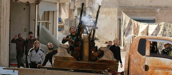 Free Syrian Army fighters fire an anti-aircraft weapon towards forces loyal to Syria's President Bashar al-Assad in the Handarat area, north of Aleppo November 30, 2014 - Sputnik Mundo